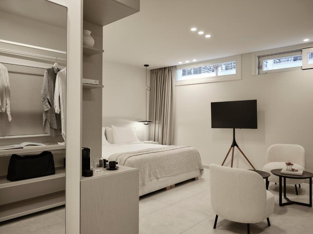 Postel nebo postele na pokoji v ubytování Doryssa Method Hotel