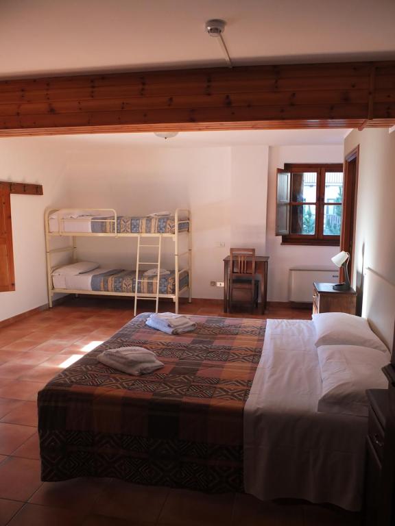 Postel nebo postele na pokoji v ubytování Casa Guigas