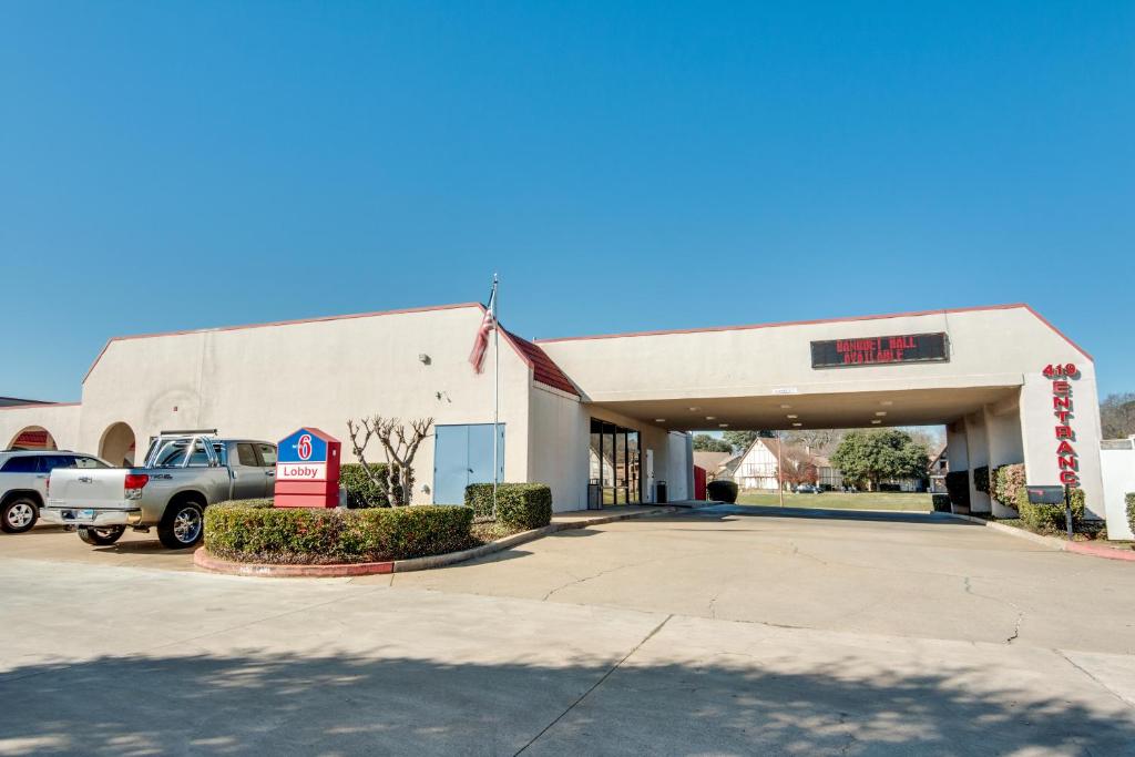 a gas station with a truck parked in a parking lot at Motel 6-Longview, TX - North in Longview