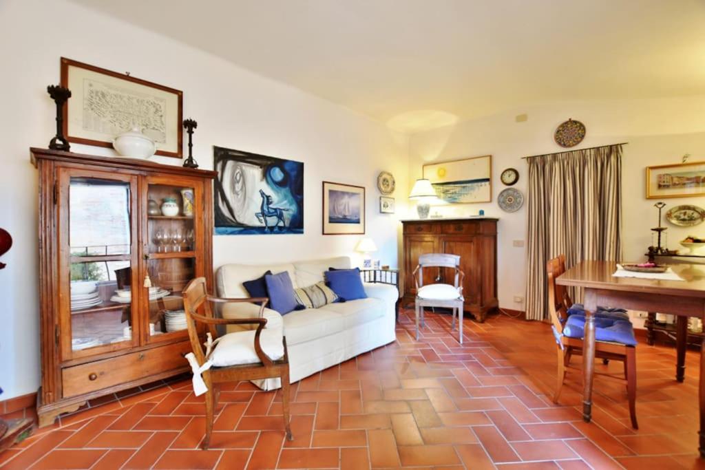 a living room with a couch and a table at Palazzo Alavolini - the loft suite in Fano