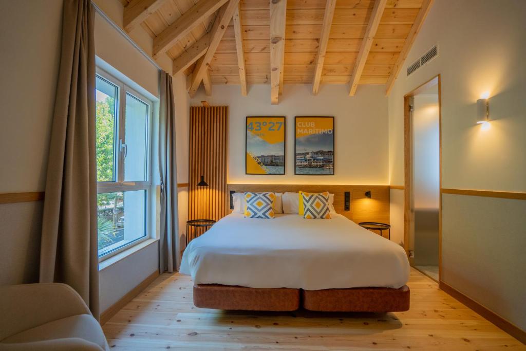Postel nebo postele na pokoji v ubytování Sercotel El Balcón de la Bahía Suites