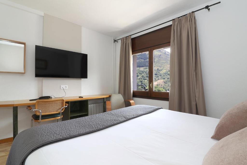 Postel nebo postele na pokoji v ubytování Hotel Blu Aran