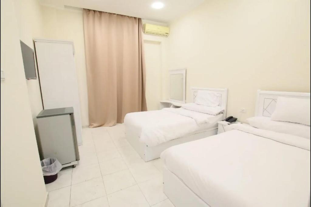 Postel nebo postele na pokoji v ubytování Cairo Crown Hotel