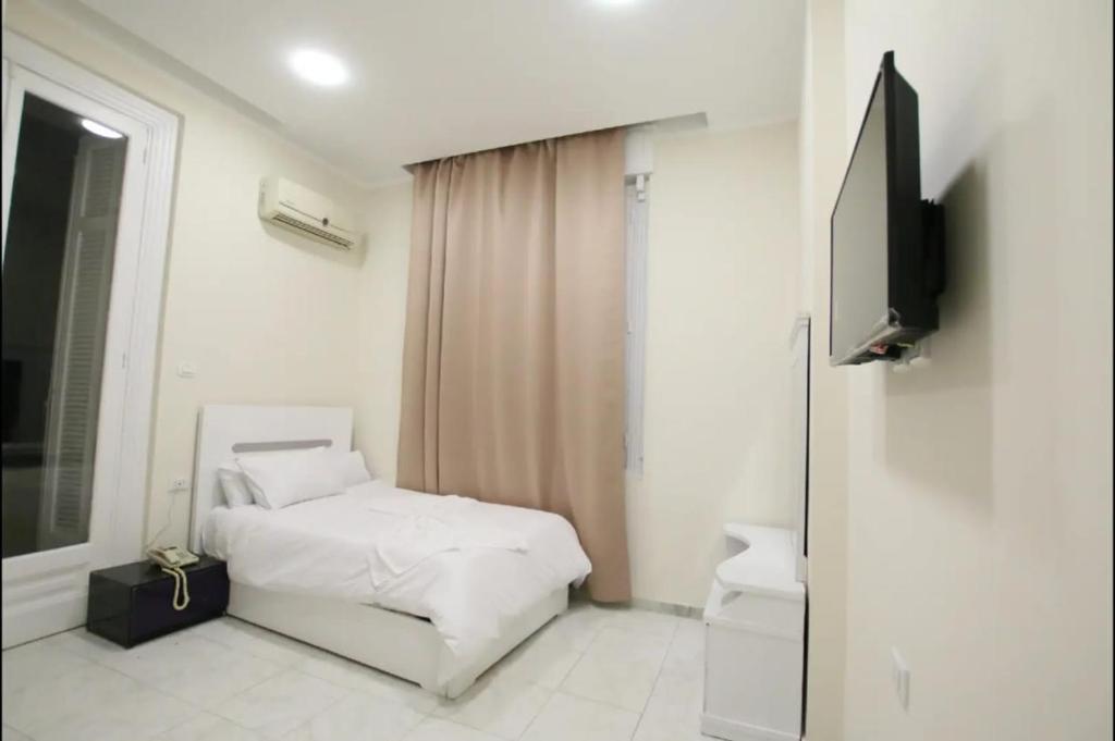 TV a/nebo společenská místnost v ubytování Cairo Crown Hotel
