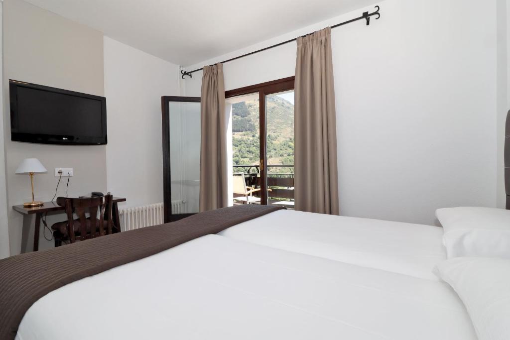 Postel nebo postele na pokoji v ubytování Hotel Blu Aran