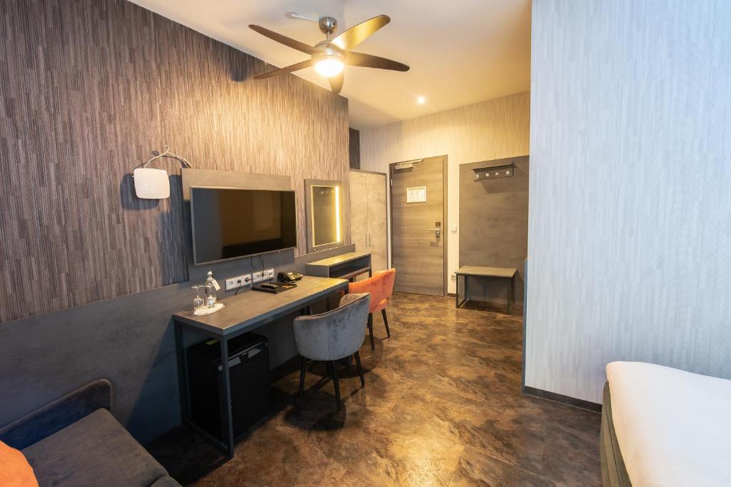 TV a/nebo společenská místnost v ubytování GS Hotel