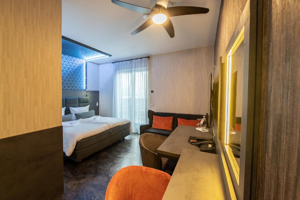 Postel nebo postele na pokoji v ubytování GS Hotel