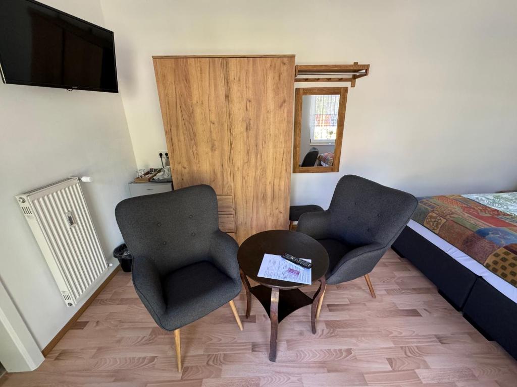 TV a/nebo společenská místnost v ubytování Bed & Breakfast am Waldgürtel