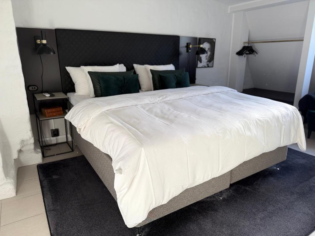 Postel nebo postele na pokoji v ubytování Hotell Onyxen, boutique- & lifestyle, Adults Only