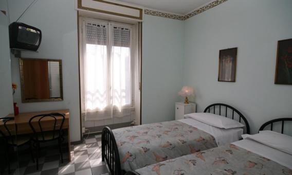 Postel nebo postele na pokoji v ubytování Hotel Eva