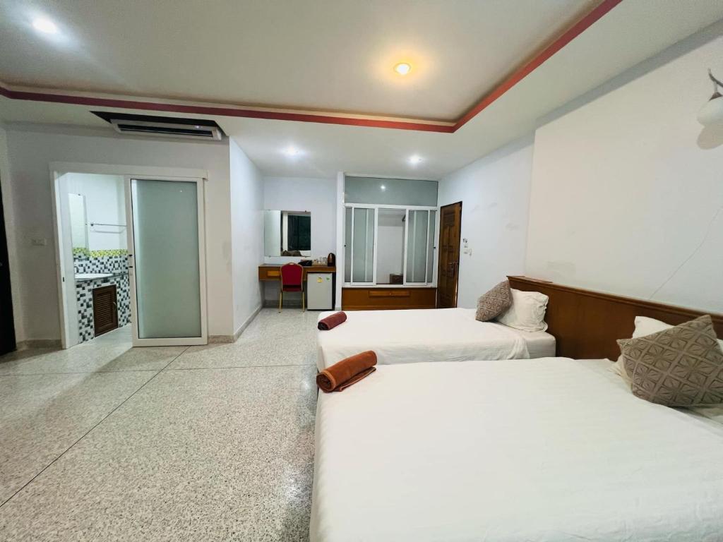 Postel nebo postele na pokoji v ubytování The Grand Koh Chang Hotel