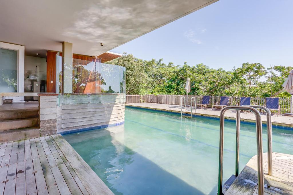 a swimming pool in a house with a house at 11 Dash, Dunkirk Estate in Ballito