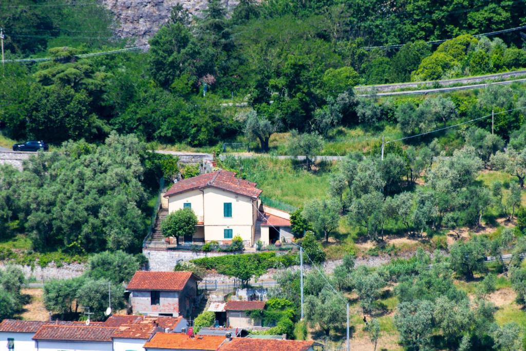 a small village with a house on a hill at Casa Natalina in Montecatini Terme