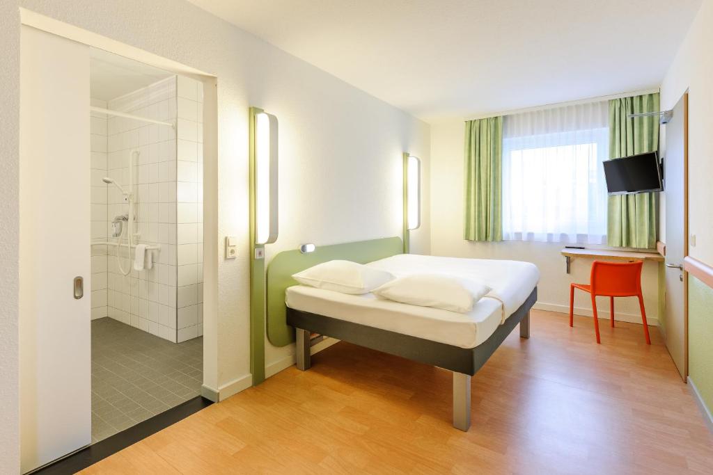 Postel nebo postele na pokoji v ubytování Ibis Budget Bamberg
