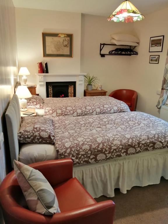 Postel nebo postele na pokoji v ubytování Lion Hotel