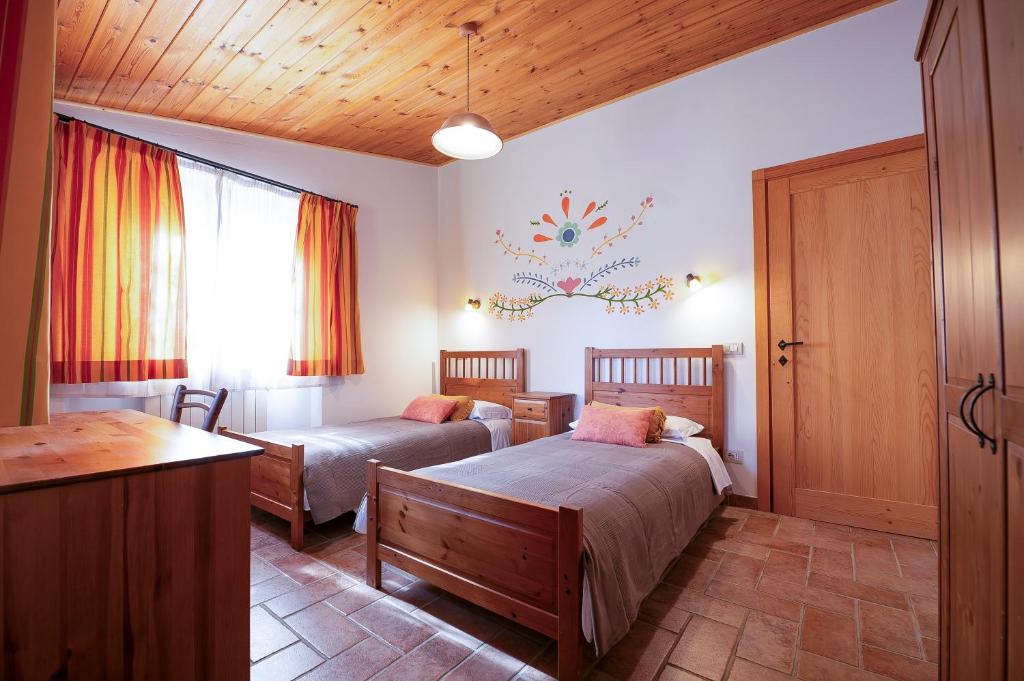Łóżko lub łóżka w pokoju w obiekcie Agriturismo Fattoria Walden