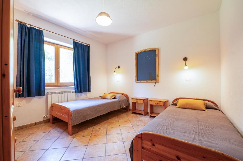 Łóżko lub łóżka w pokoju w obiekcie Agriturismo Fattoria Walden