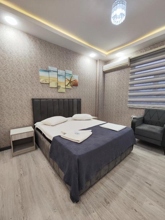 Postel nebo postele na pokoji v ubytování Gemi Hotel