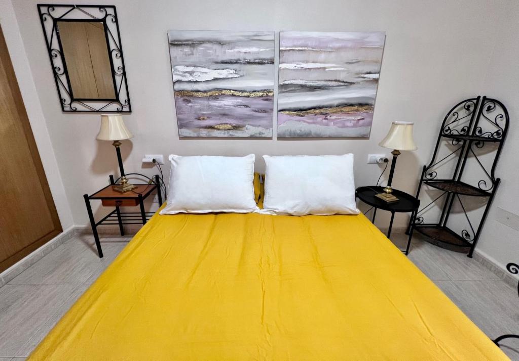 Postel nebo postele na pokoji v ubytování Apartamentos Arcos Céntrico