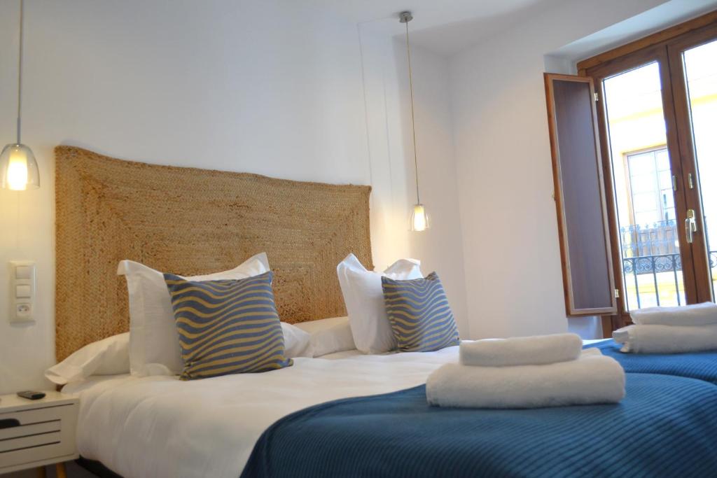 Postel nebo postele na pokoji v ubytování Sunshine San Fernando