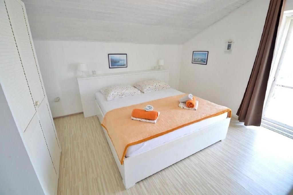 Posteľ alebo postele v izbe v ubytovaní Apartment Denko