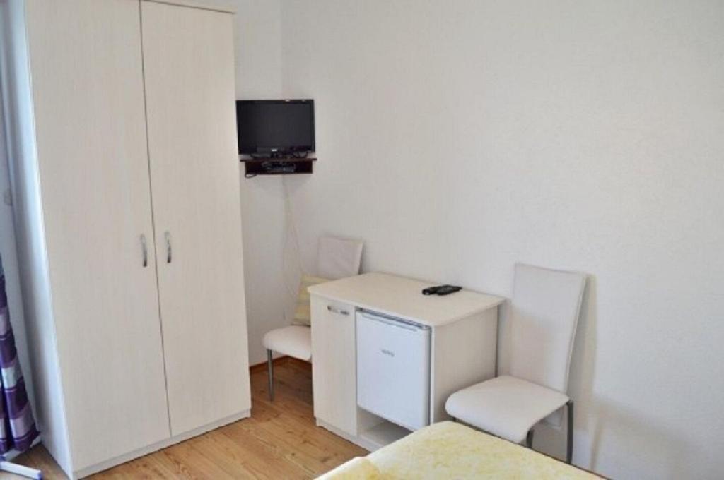 Televízia a/alebo spoločenská miestnosť v ubytovaní Apartment Denko