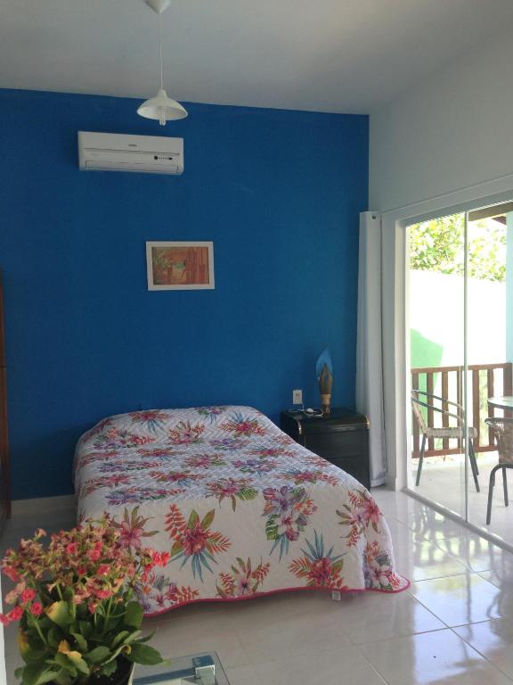 Postel nebo postele na pokoji v ubytování Pipa Hawaii Suites