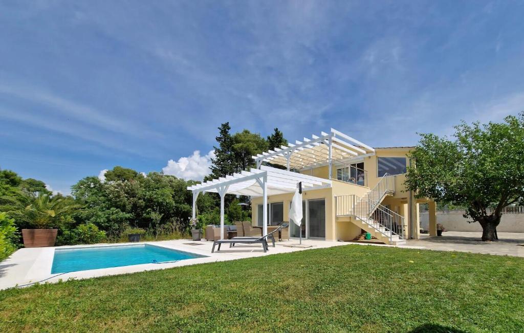a home with a swimming pool and a house at Großes Ferienhaus Zur Alleinigen Nutzung Mit Pool in Bilice