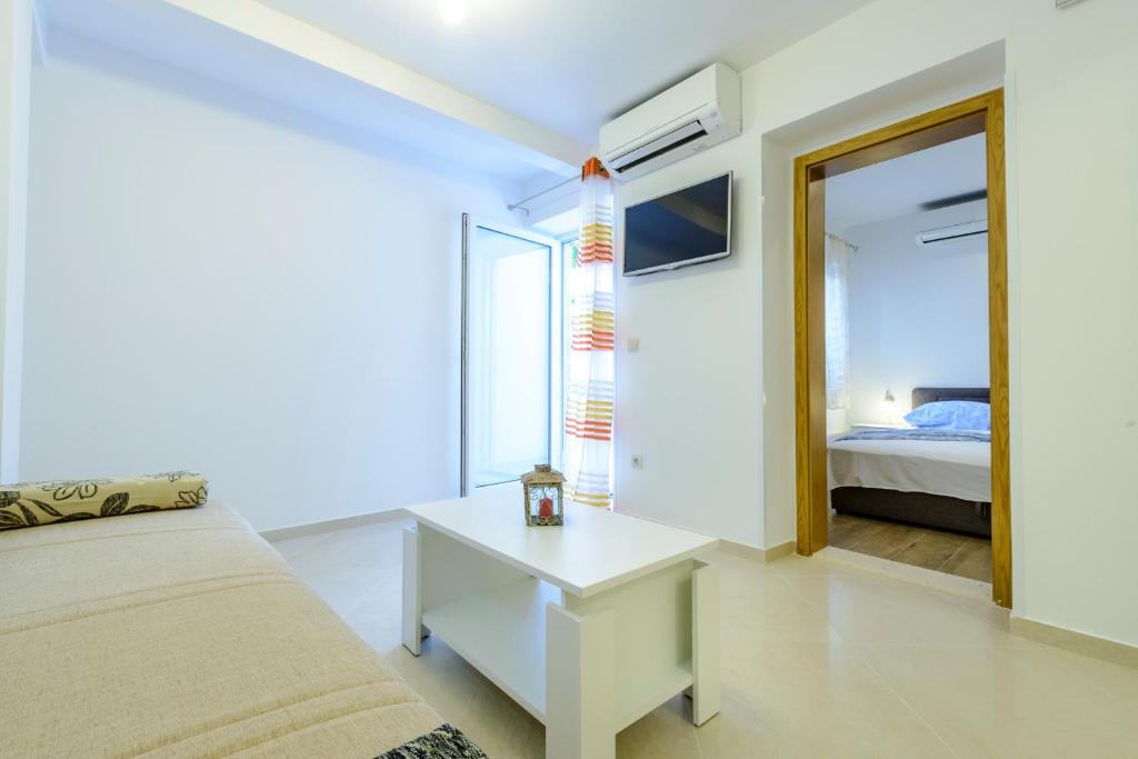 Posteľ alebo postele v izbe v ubytovaní Imperium Apartments