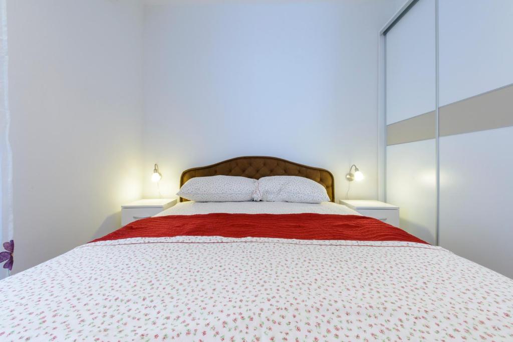 Posteľ alebo postele v izbe v ubytovaní Imperium Apartments