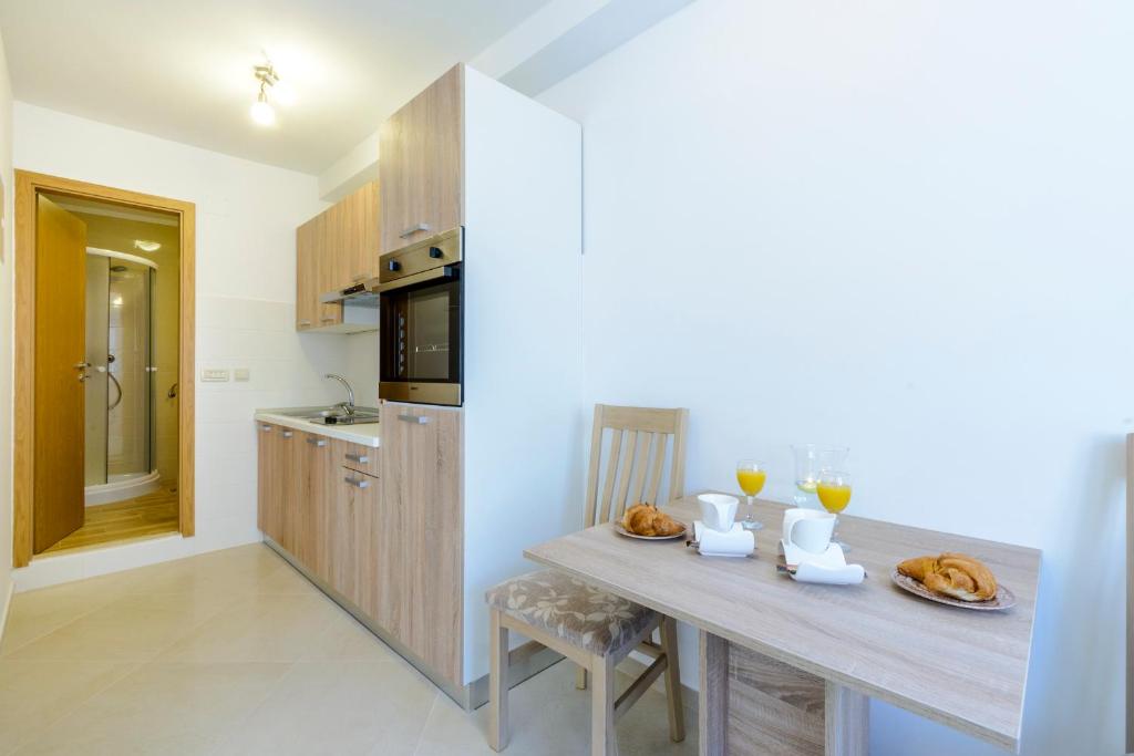 Kuchyňa alebo kuchynka v ubytovaní Imperium Apartments