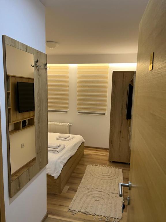 Postel nebo postele na pokoji v ubytování Honey Valley Bjelašnica