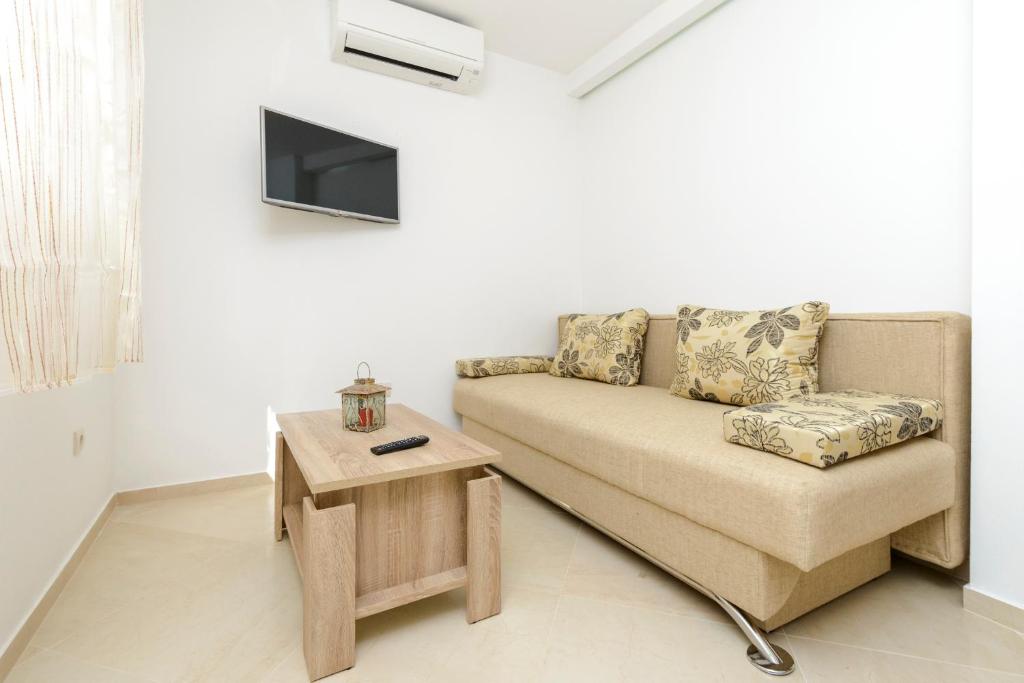 Televízia a/alebo spoločenská miestnosť v ubytovaní Imperium Apartments