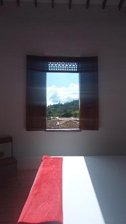 Postel nebo postele na pokoji v ubytování La Oculta Hostal