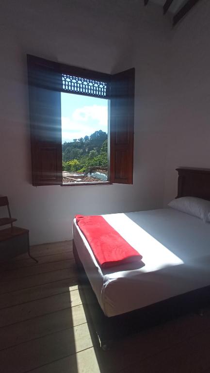 Postel nebo postele na pokoji v ubytování La Oculta Hostal