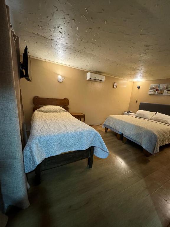 Postel nebo postele na pokoji v ubytování Cabaña ubicada en sector zapallar, perfecta para descansar