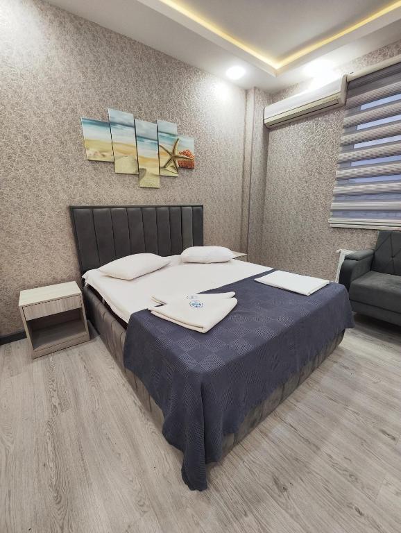 Postel nebo postele na pokoji v ubytování Gemi Hotel