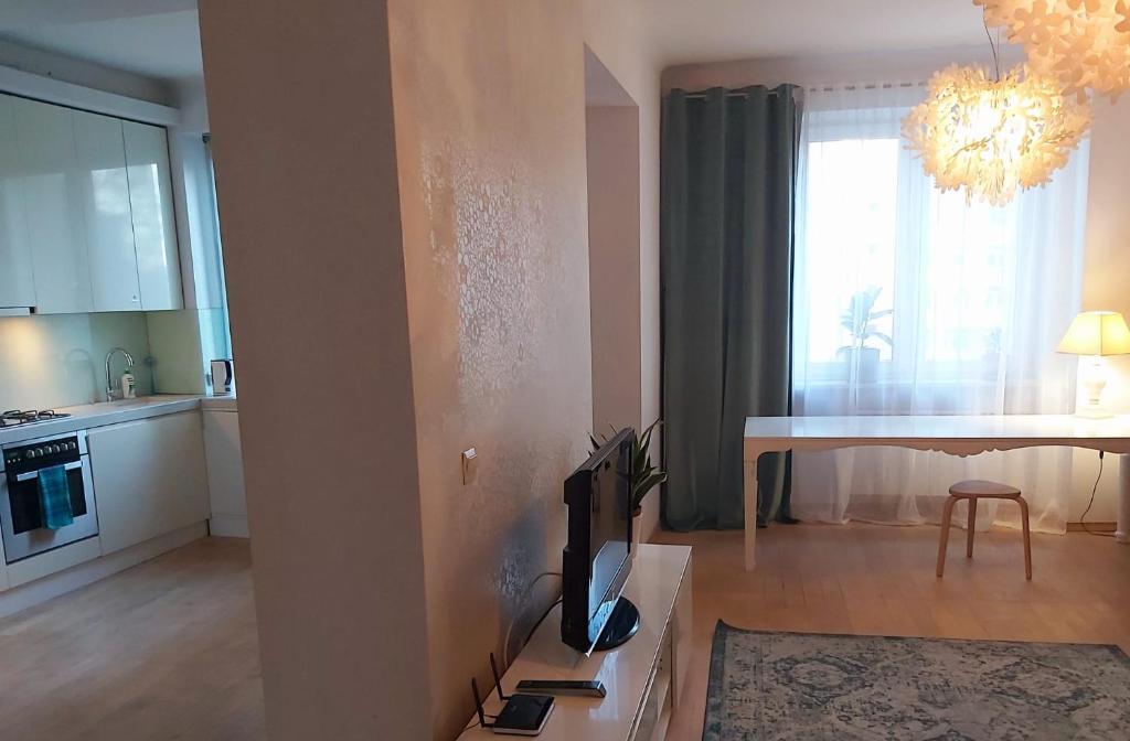 Kuchyňa alebo kuchynka v ubytovaní Apartament Koszykowa 1