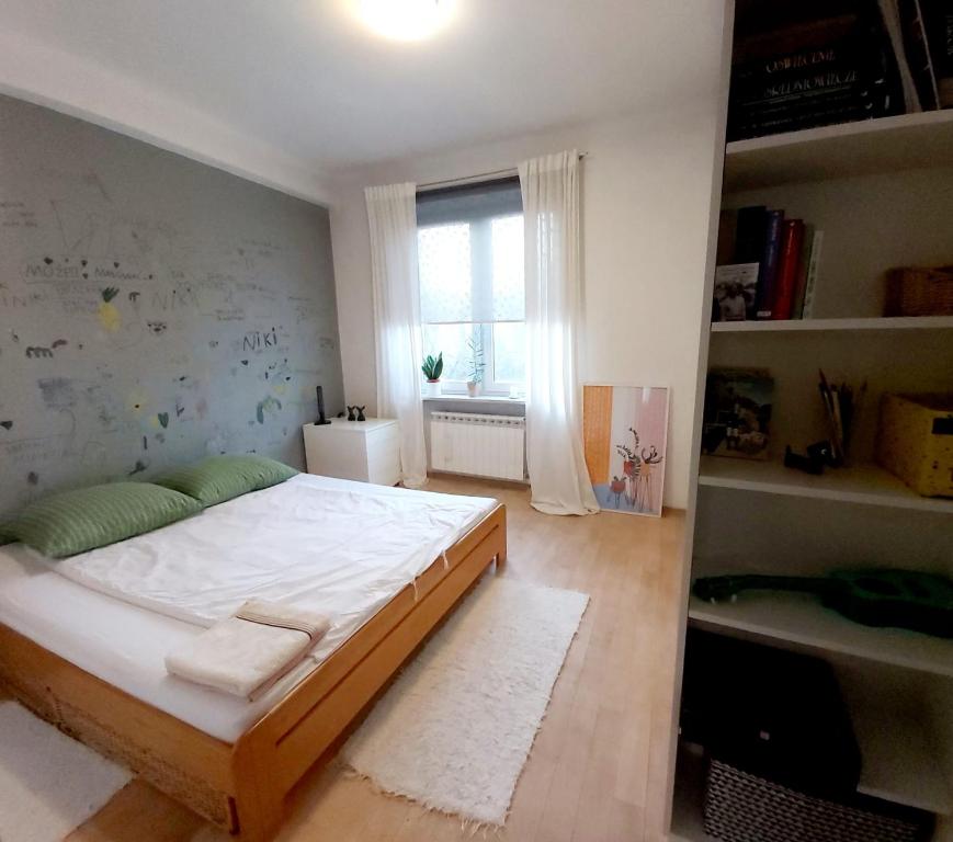 Posteľ alebo postele v izbe v ubytovaní Apartament Koszykowa 1