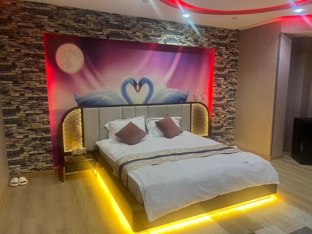 Postel nebo postele na pokoji v ubytování JubingeHotel 聚滨阁民宿