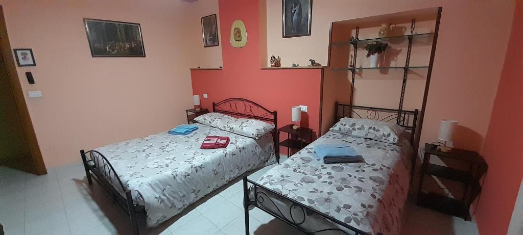 Postel nebo postele na pokoji v ubytování Le Vecchie Mura B & B