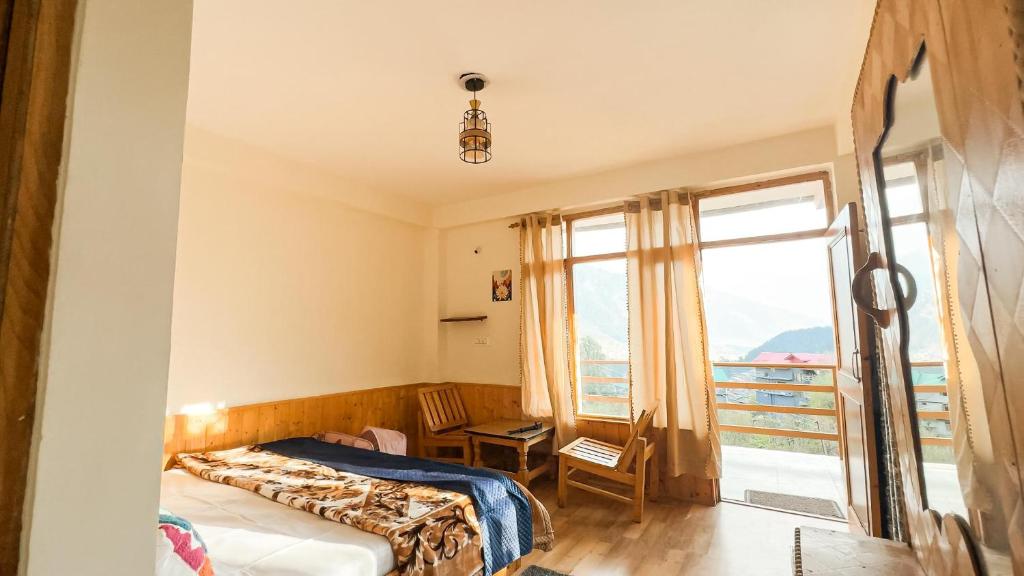 Postel nebo postele na pokoji v ubytování Bayith Cafe and Stay