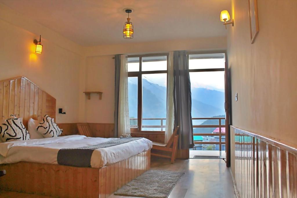 Postel nebo postele na pokoji v ubytování Bayith Cafe and Stay