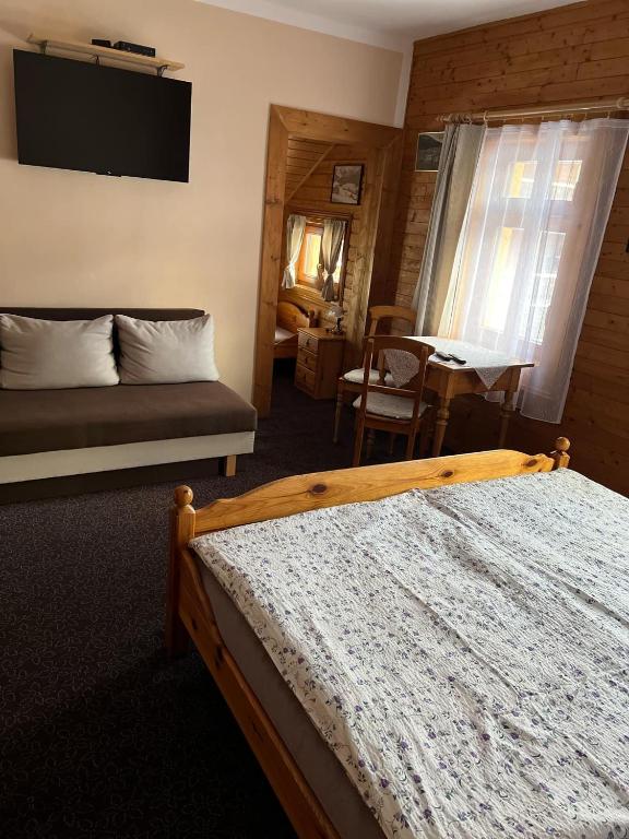 Postel nebo postele na pokoji v ubytování Pension Jaruska