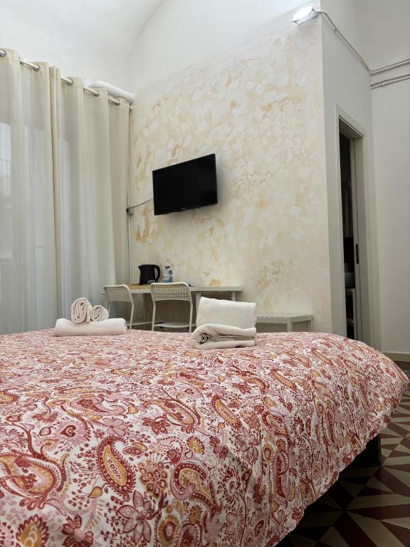Televízia a/alebo spoločenská miestnosť v ubytovaní Il Teatro Rooms