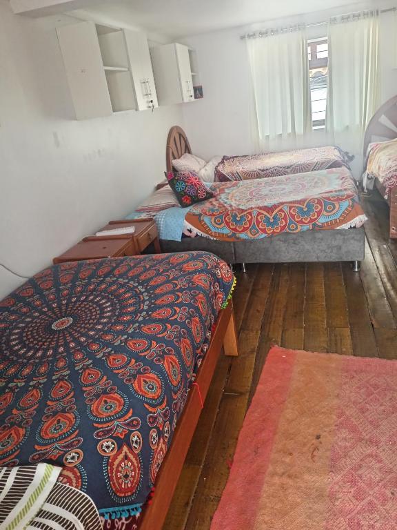 Una cama o camas en una habitación de Hostel mágico San Blas