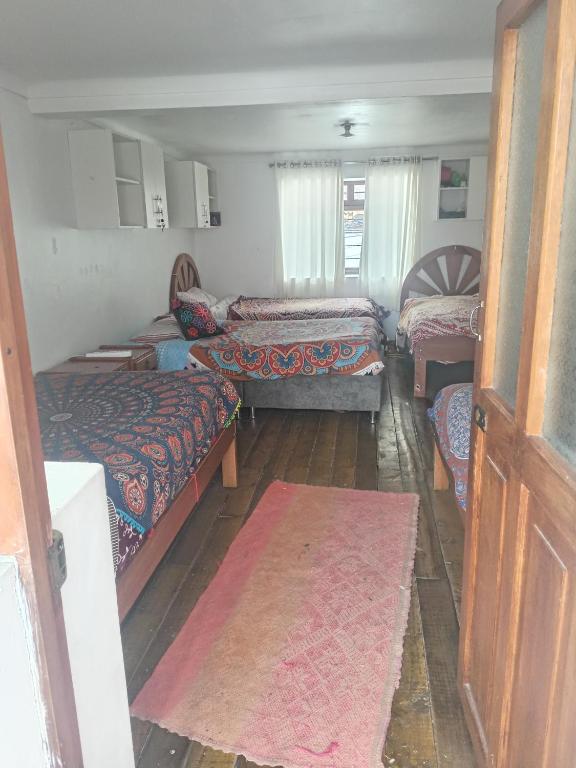 Una cama o camas en una habitación de Hostel mágico San Blas