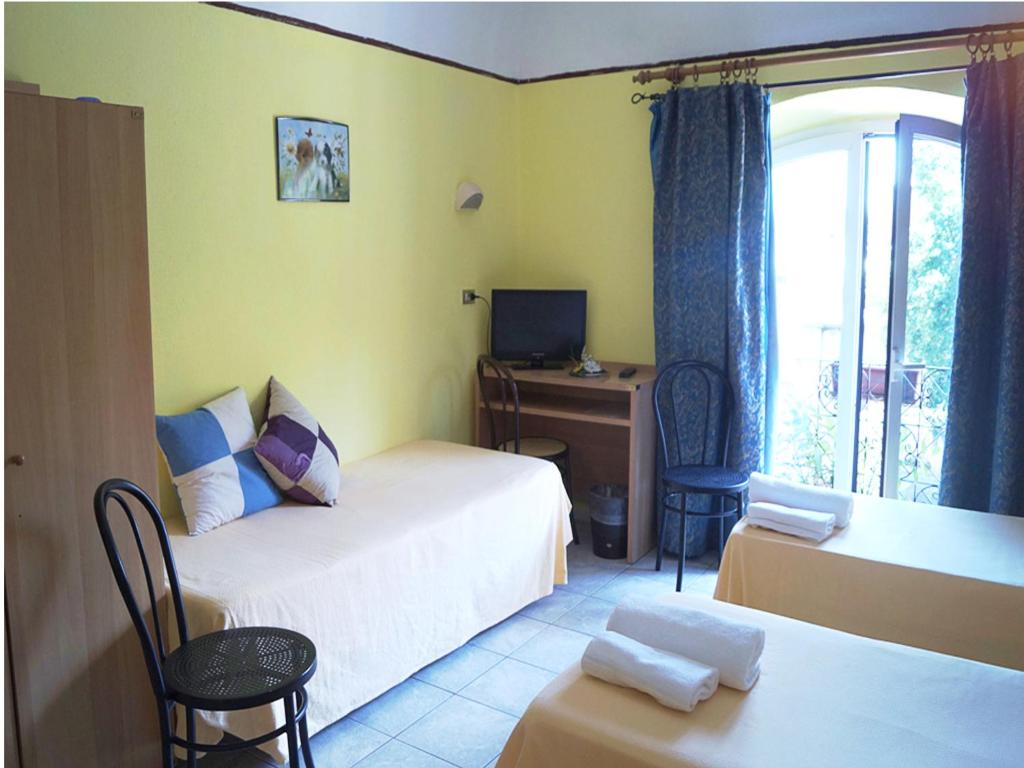 Postel nebo postele na pokoji v ubytování Hotel Stazione