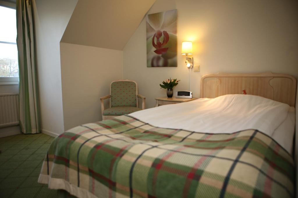Postel nebo postele na pokoji v ubytování Hotel Mölndals Bro