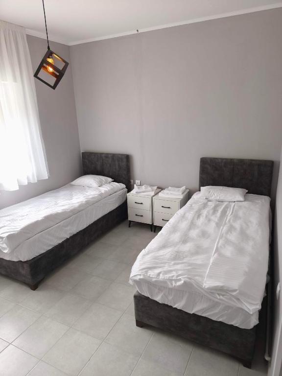 Katil atau katil-katil dalam bilik di Apartmani Trastevere Sombor